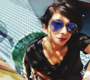 Portrait of young woman wearing sunglasses