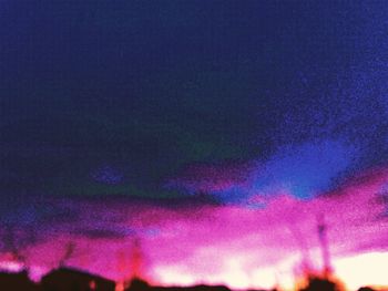 Low angle view of rainbow against sky at night