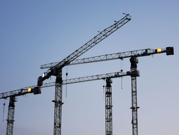 Construction boom, construction equipment, dark blue sky, sunset