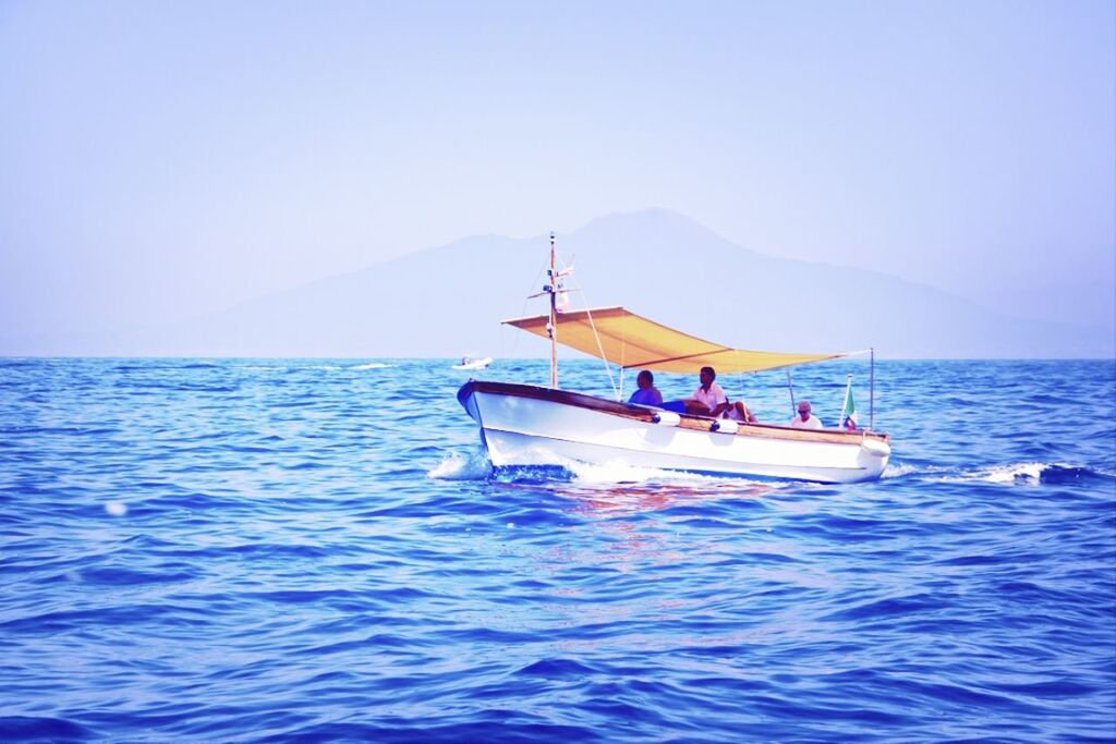 water, sea, waterfront, clear sky, horizon over water, copy space, nautical vessel, tranquil scene, scenics, tranquility, rippled, beauty in nature, nature, men, blue, leisure activity, transportation, boat, lifestyles