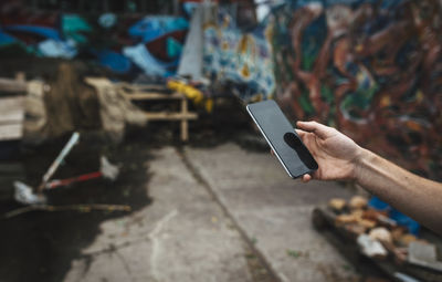 Close-up of hand using mobile phone