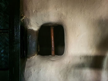 Abandoned building seen through window