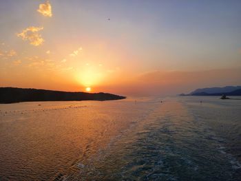 Scenic view of beach against sky during sunset