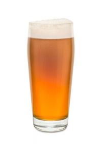 Close-up of beer glass against white background