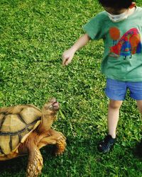 Full length of child on field