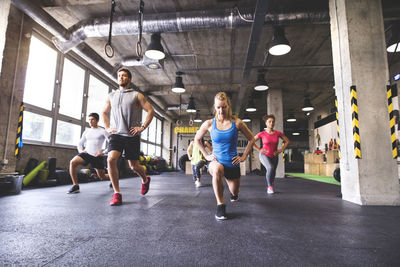 Group of young people exercising in gym