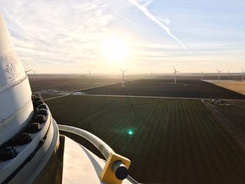 Scenic view of wind turbines on field