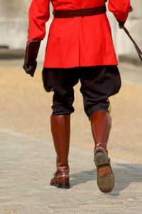 Low section of army soldier walking outdoors