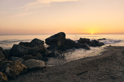 Scenic view of sea against sky during sunset