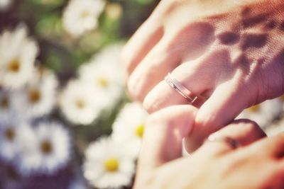 Close-up of couple hands making pinky promise