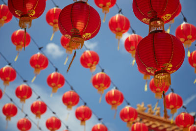 Red chinese lanterns hanging in row