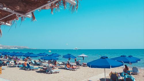 Panoramic view of beach against clear blue sky