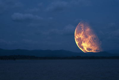 Scenic view of sea against sky at night