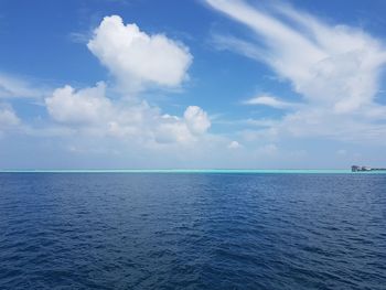 Scenic view of seascape against blue sky