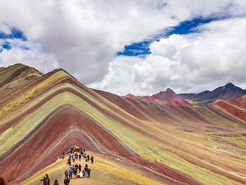 Scenic view of mountain against cloudy sky