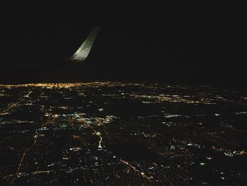 Aerial view of illuminated cityscape at night