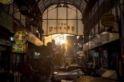 Illuminated street market in city