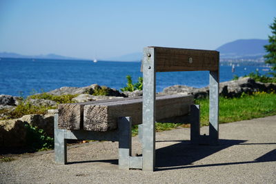 Lifeguard hut on beach against clear sky