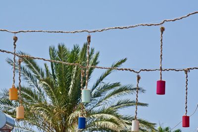 Low angle view of hanging against sky