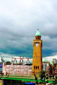 Buildings against cloudy sky