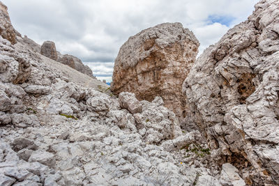 Low angle view of rocks against sky