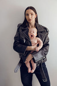 Portrait of young woman with teddy bear