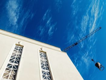 Low angle view of building against blue sky