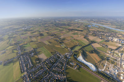 Aerial view of agricultural field against sky