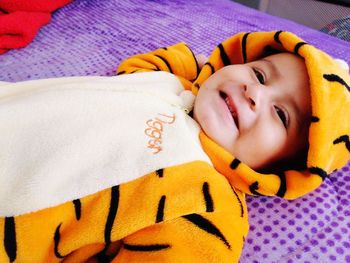 Portrait of woman sleeping on bed