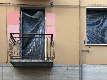 Abandoned building seen through glass window