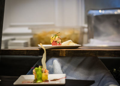 Close-up of fruits in plate on table in restaurant 