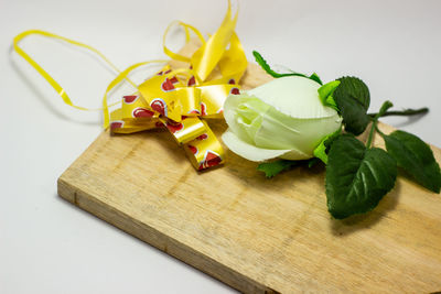 High angle view of fruits and leaves on table