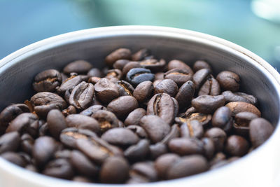 High angle view of roasted coffee beans in bowl