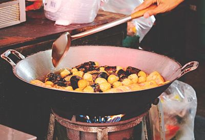 Midsection of man preparing food