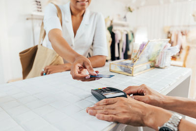 Midsection of woman working on table