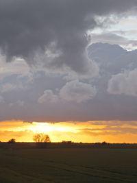 Scenic view of landscape at sunset