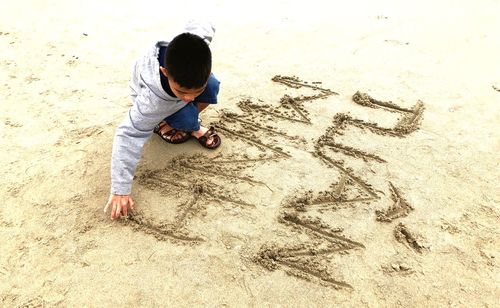 High angle view of boy on beach