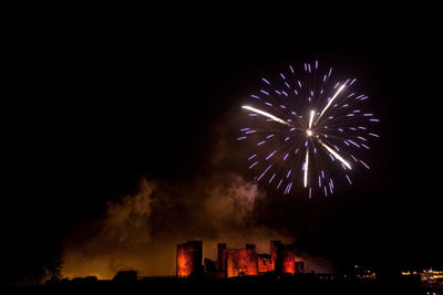 Low angle view of firework display