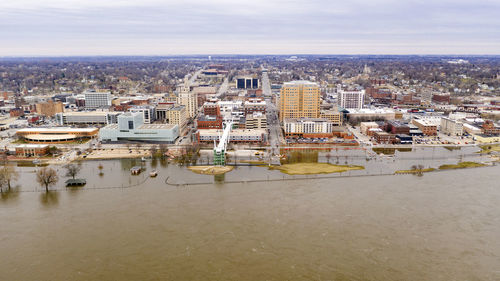 High angle view of river amidst buildings in city