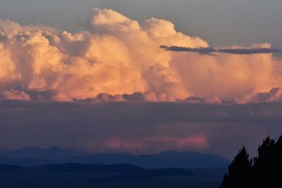 Scenic view of silhouette mountains against sky at sunset
