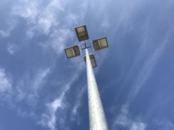 Low angle view of street light against blue sky