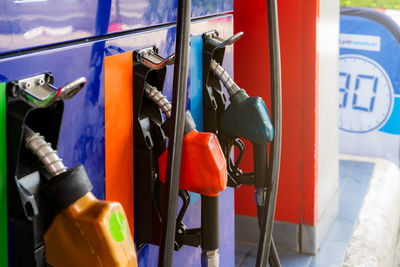 Petrol pump filling fuel nozzle in gas station. fuel dispenser. refuel fill up with petrol gasoline.