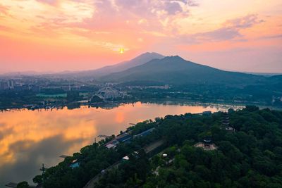 Scenic view of townscape against sky during sunset