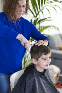 Rear view of friends sitting outdoors