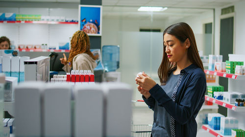 Portrait of young businesswoman working in office