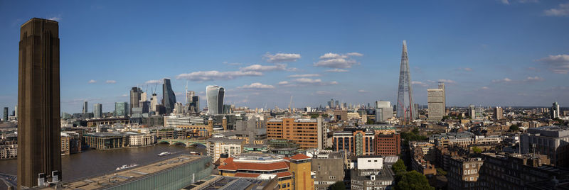 Modern buildings in city against sky