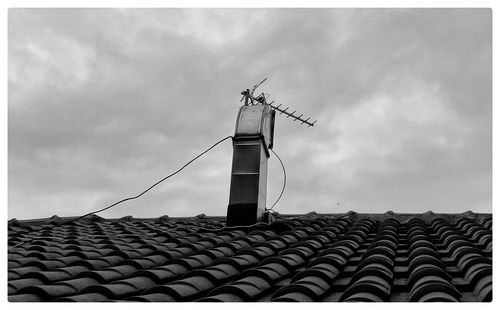 Low angle view of roof against sky