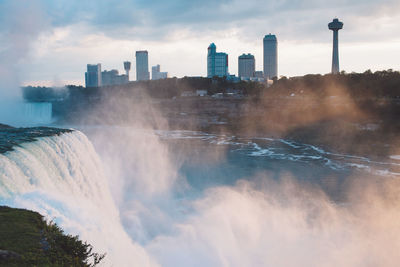 Niagara falls against buildings in city