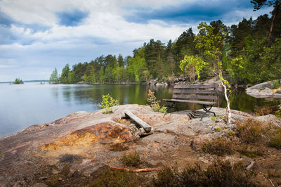 Scenic view of lake against cloudy sky