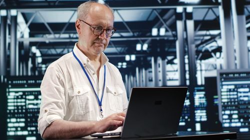 Man using laptop at office